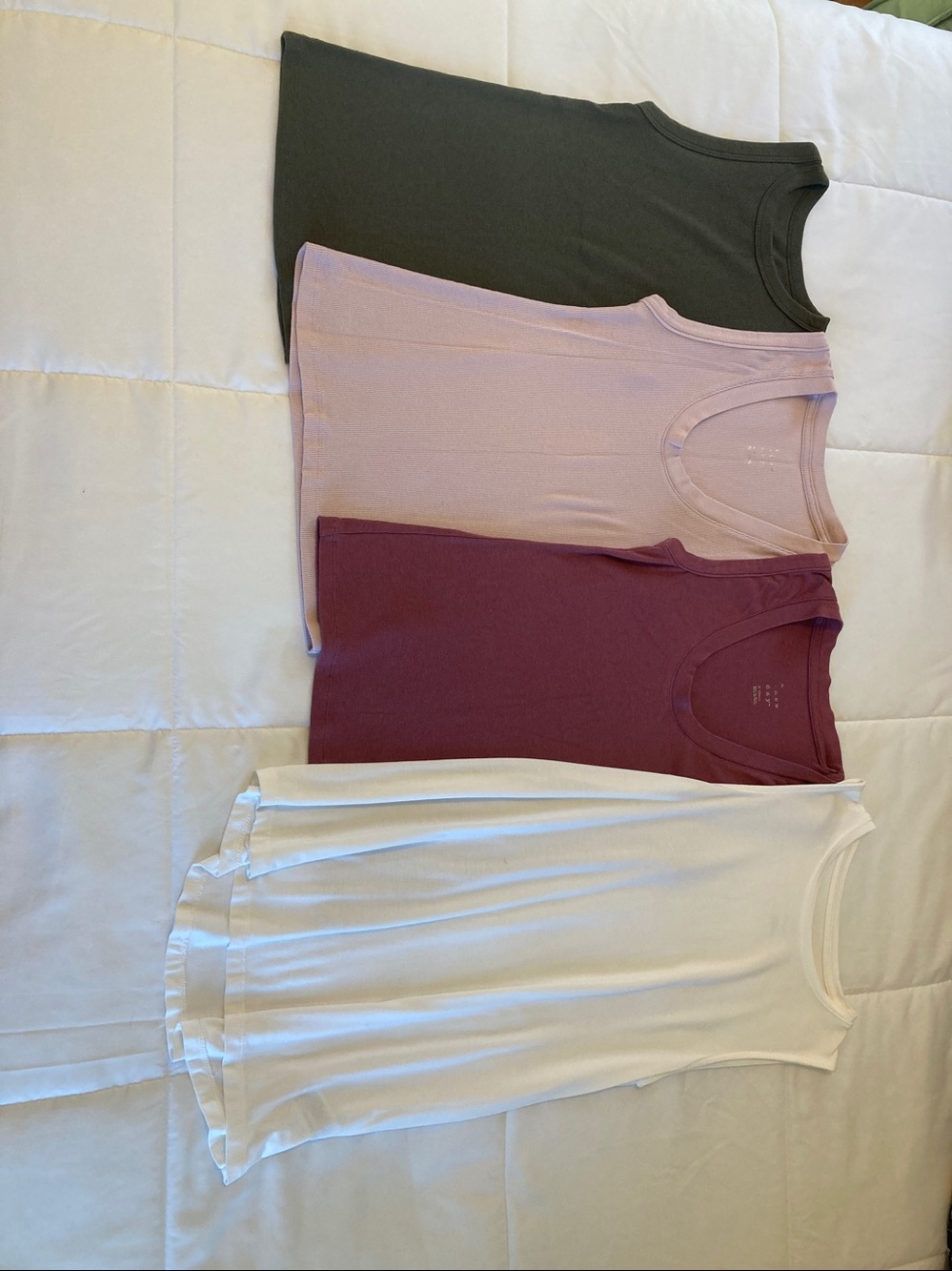 4 tank tops. Size XS.